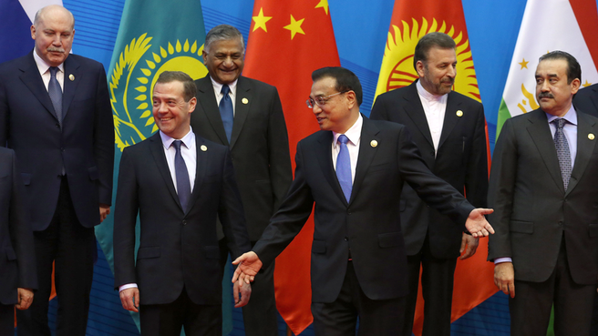 SCO heads of government and observer states’ heads of delegation pose for a group photo