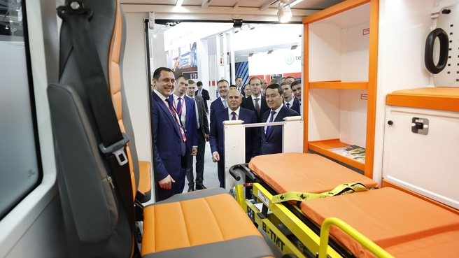 Mikhail Mishustin and Prime Minister of Kazakhstan Alikhan Smailov tour INNOPROM 2022. Examining an ambulance based on the LADA NIVA LEGEND 4x4 PRIMA by Shvabe at the Rostec state corporation stand. Sergei Dmitrochenko, Deputy General Director for Civilian Product Sales Development at Shvabe (left)
