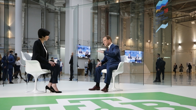 Dmitry Medvedev answers questions from TV presenter Irada Zeynalova (NTV) at the Sochi 2019 forum